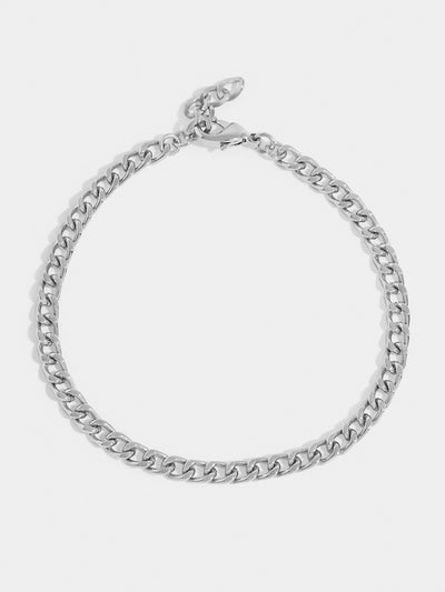 Silver plated chain. You can use it alone, mix and match with a thinner accessory. You choose how to wear it.