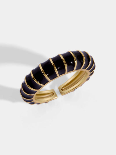 Delicate gold paved ring with black and gold spirals. Adjustable for all fit.