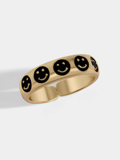 Gold pave ring with five tiny smiley face black colored. A delicate touch to your hands and a friendly reminder to be happy.