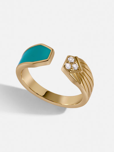 Gold paved ring with crystals in one half and the other with turquoise.