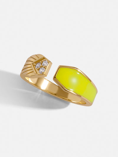 Gold paved ring with crystals in one half and the other with neon yellow.
