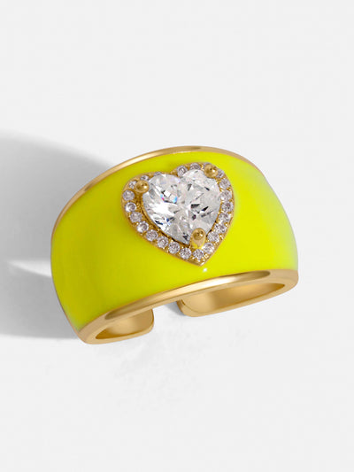 Neon yellow ring with emerald zircon in the shape of a heart. Made with gold plating and crystals. Fill your life with colors!