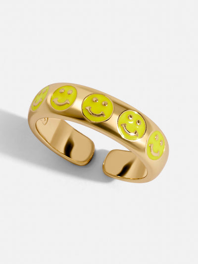 Gold pave ring with five tiny smiley face neon yellow colored. A delicate touch to your hands and a friendly reminder to be happy.