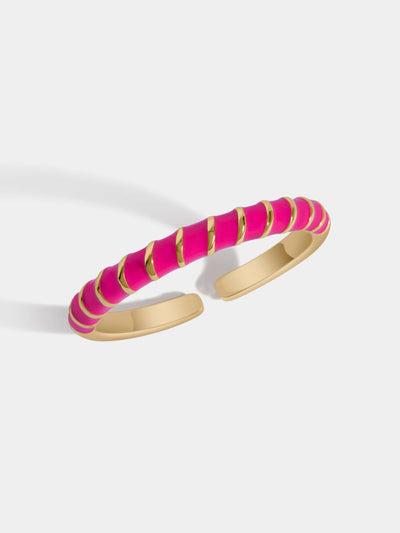 Delicate gold paved ring with neon pink and gold spirals. Adjustable for all fit.